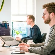 Two men working on SEO in and office
